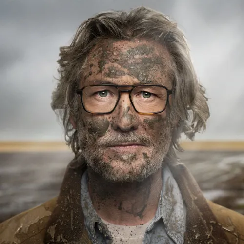 Man covered in mud 