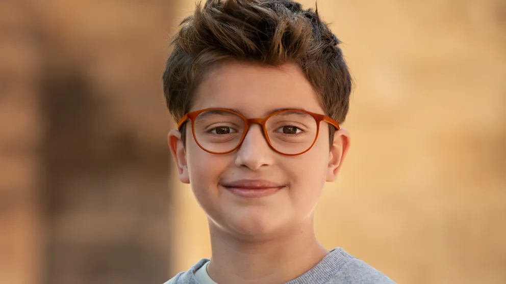A young boy wearing his MiYOSMART glasses